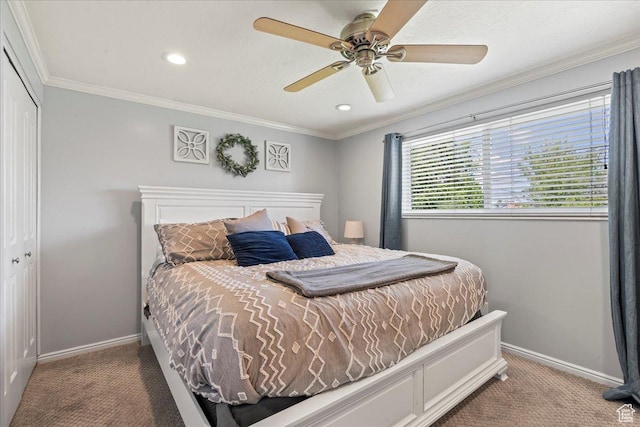 carpeted bedroom with baseboards, a closet, ornamental molding, recessed lighting, and ceiling fan
