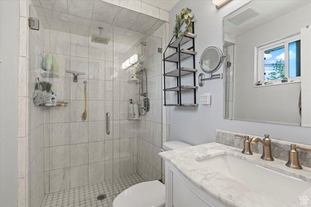 full bath with toilet, a stall shower, and vanity