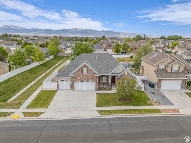 aerial view of residential area featuring a mountainous background