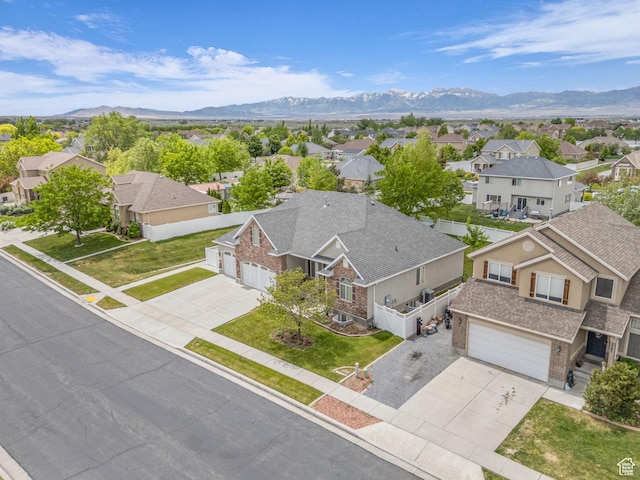 aerial perspective of suburban area with a mountainous background