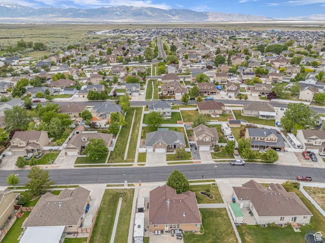view of property location featuring nearby suburban area and a mountain backdrop