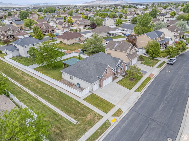 aerial view of residential area featuring a mountainous background
