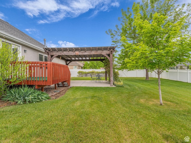 view of yard with a pergola, a patio area, and a wooden deck