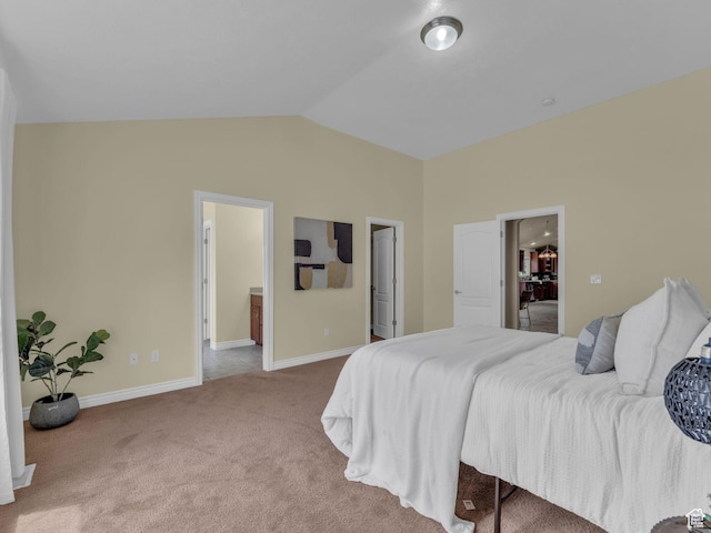 bedroom featuring carpet, vaulted ceiling, and baseboards