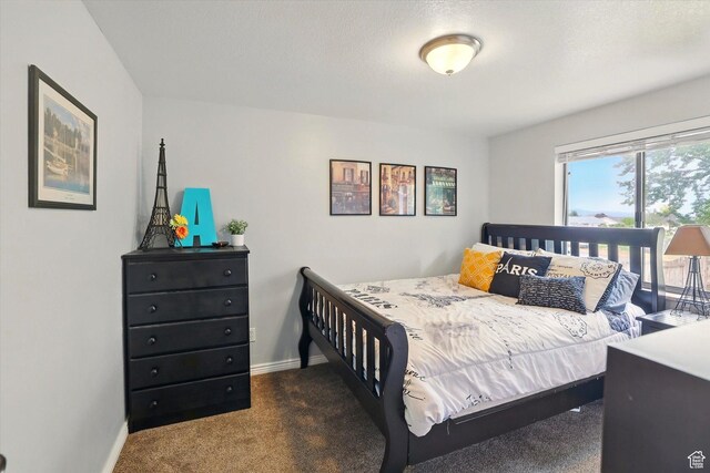 634 W 600 N, Brigham City, UT 84302 - carpeted bedroom with baseboards and access to outside