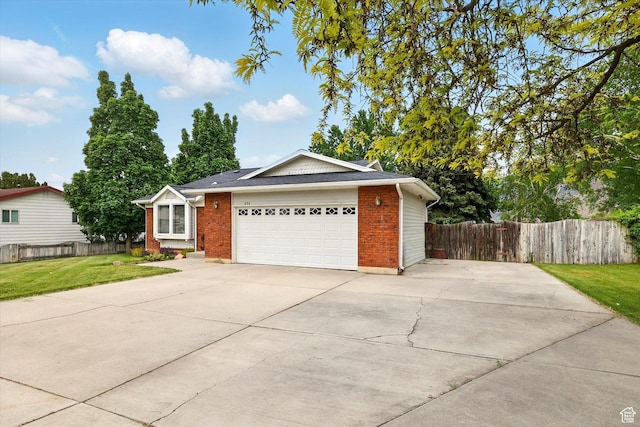 634 W 600 N, Brigham City, UT 84302 - single story home featuring brick siding, concrete driveway, and an attached garage