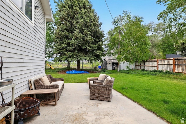 634 W 600 N, Brigham City, UT 84302 - view of patio / terrace with a fire pit, a storage unit, and an outbuilding