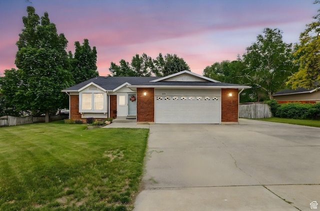 634 W 600 N, Brigham City, UT 84302 - ranch-style house with concrete driveway, a garage, and brick siding