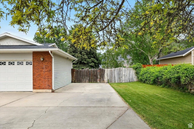 634 W 600 N, Brigham City, UT 84302 - view of yard featuring a garage and concrete driveway