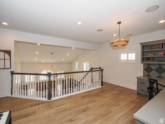 office with a chandelier, light wood-style floors, healthy amount of natural light, baseboards, and recessed lighting