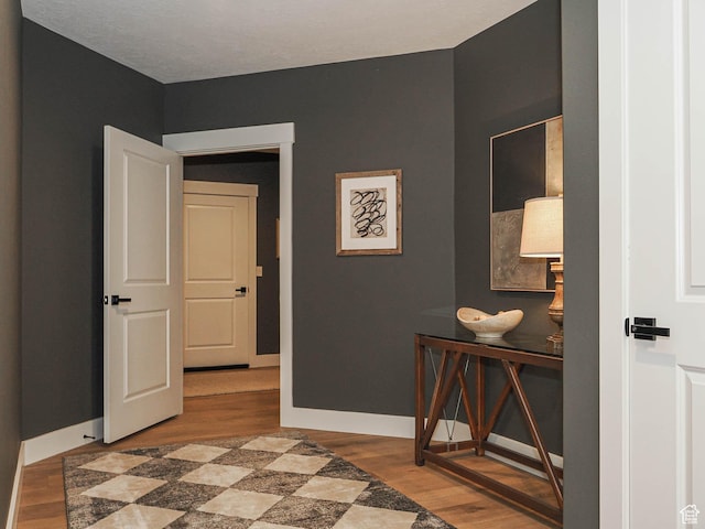 bedroom featuring wood finished floors and baseboards