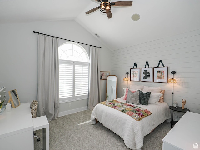 bedroom with lofted ceiling, carpet flooring, a ceiling fan, and baseboards