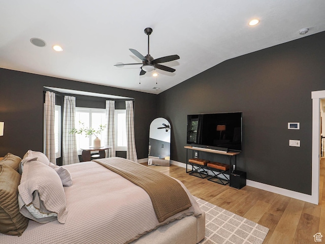 bedroom featuring vaulted ceiling, light wood finished floors, baseboards, recessed lighting, and ceiling fan