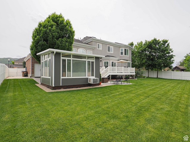 back of property featuring a sunroom, a patio, cooling unit, and stucco siding
