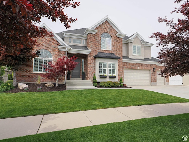 view of front of property featuring an attached garage, a front yard, concrete driveway, brick siding, and a shingled roof