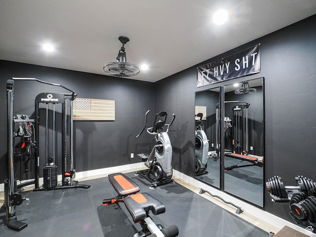 exercise area with recessed lighting and baseboards