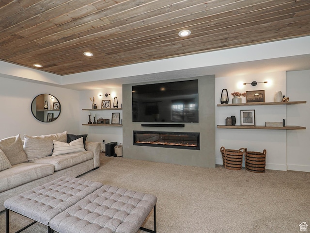 carpeted living area with wooden ceiling, a glass covered fireplace, and recessed lighting