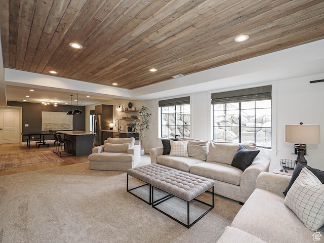 living area featuring wood ceiling, recessed lighting, and wood finished floors