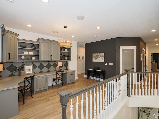 kitchen with open shelves, gray cabinetry, light wood-style floors, recessed lighting, and light countertops