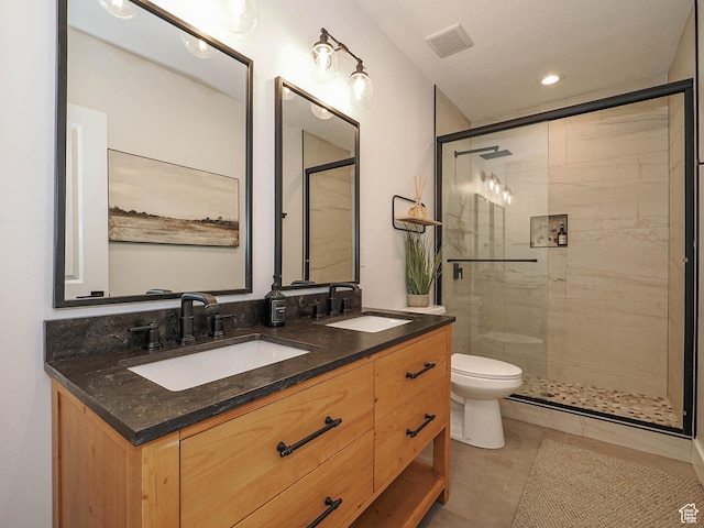 full bath featuring a stall shower, toilet, double vanity, tile patterned floors, and recessed lighting