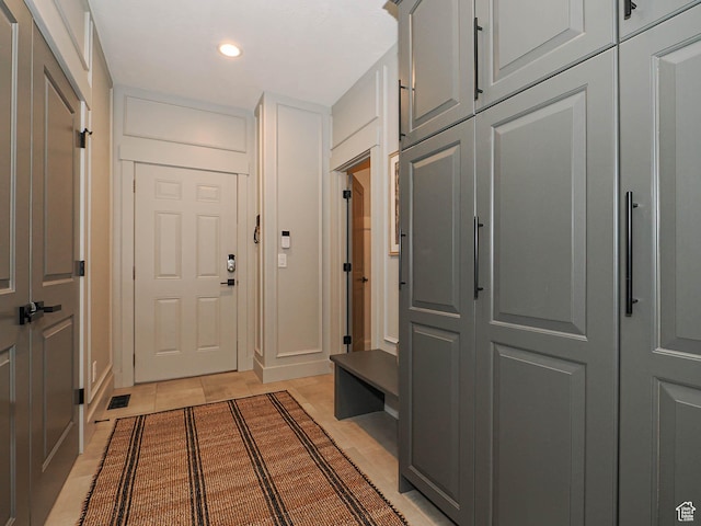 mudroom featuring light tile patterned floors and recessed lighting