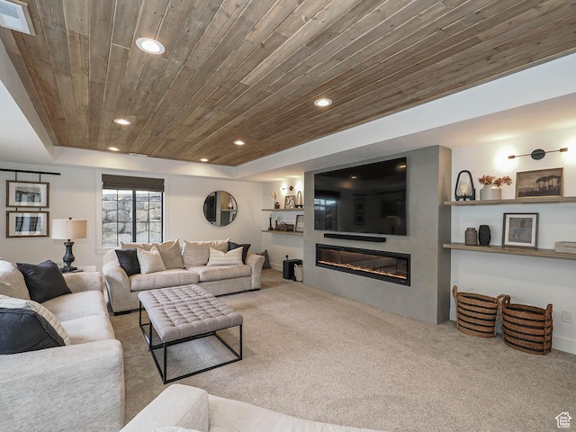 living area featuring wood ceiling, carpet, recessed lighting, and a glass covered fireplace