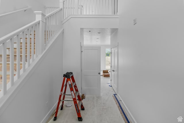 staircase featuring baseboards