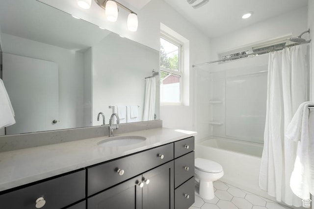 441 N Bishop Pl Unit 4-17, Salt Lake City, UT 84103 - bathroom with toilet, tile patterned floors, vanity, and shower / bathtub combination with curtain