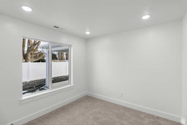 unfurnished room featuring carpet, baseboards, and recessed lighting