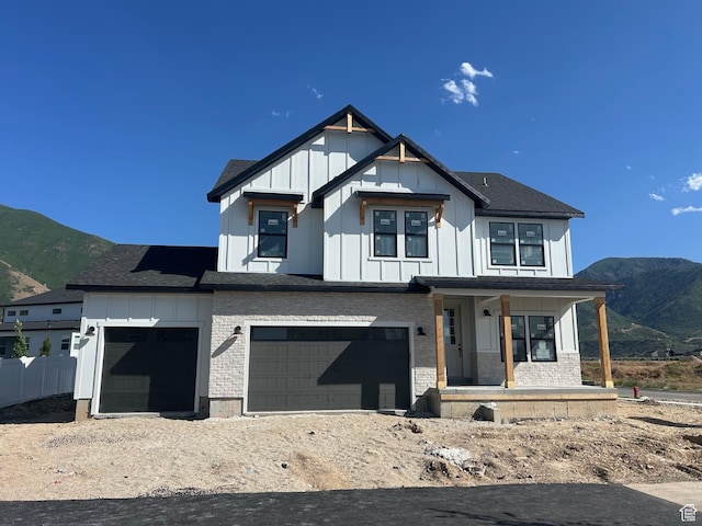 1015 W Sugar Maple Dr Unit 110, Mapleton, UT 84664 - modern inspired farmhouse featuring a porch, board and batten siding, a mountain view, a garage, and brick siding