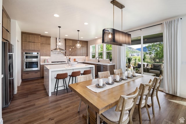 1015 W Sugar Maple Dr, Mapleton, UT 84664 - dining area with dark wood-style flooring and recessed lighting