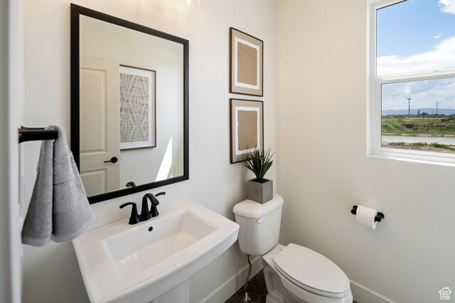 1015 W Sugar Maple Dr, Mapleton, UT 84664 - bathroom with toilet, a sink, and baseboards