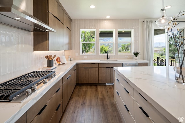 1015 W Sugar Maple Dr, Mapleton, UT 84664 - kitchen featuring wall chimney exhaust hood, a sink, stainless steel gas stovetop, backsplash, and recessed lighting