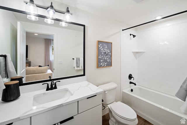 1015 W Sugar Maple Dr, Mapleton, UT 84664 - ensuite bathroom featuring toilet, vanity, washtub / shower combination, and wood finished floors