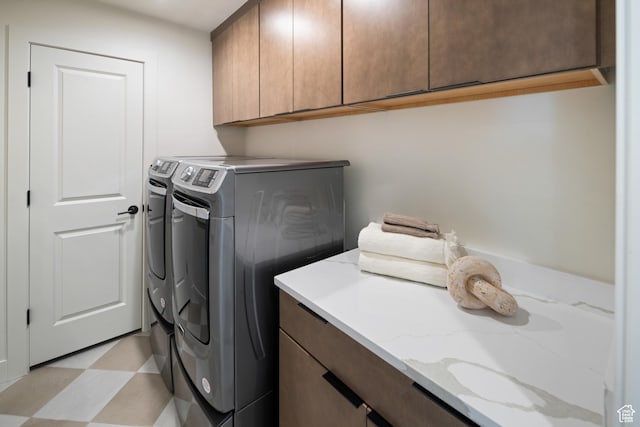1015 W Sugar Maple Dr, Mapleton, UT 84664 - clothes washing area featuring cabinet space, washer and dryer, and light flooring