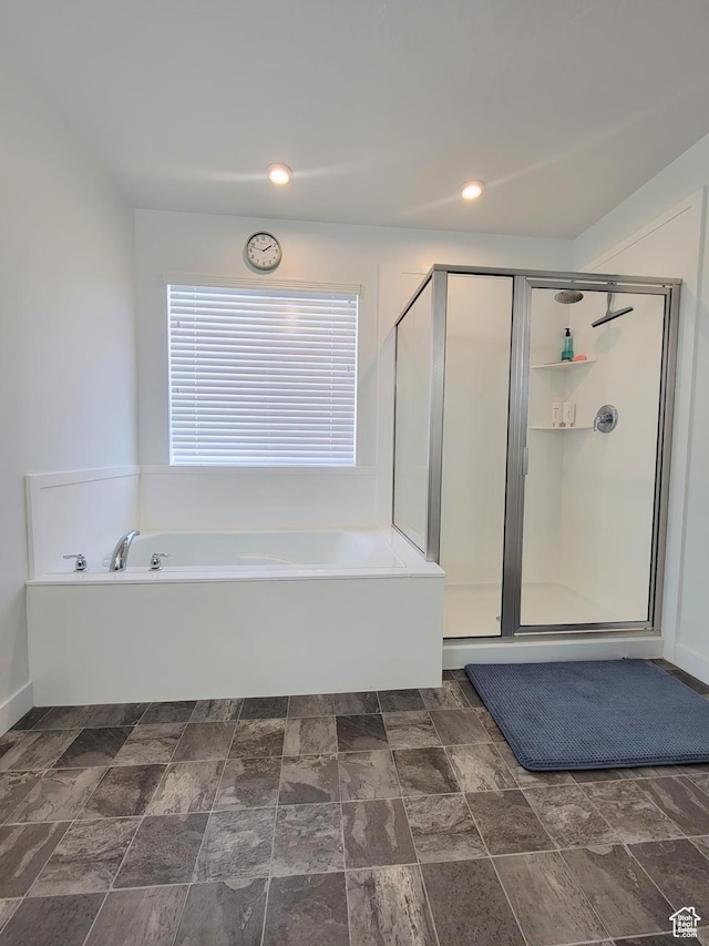 full bath with a garden tub, a stall shower, stone finish floors, and recessed lighting