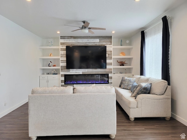 living area with baseboards, a ceiling fan, dark wood-style flooring, recessed lighting, and built in features