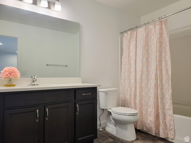 full bathroom with toilet, vanity, and shower / tub combo