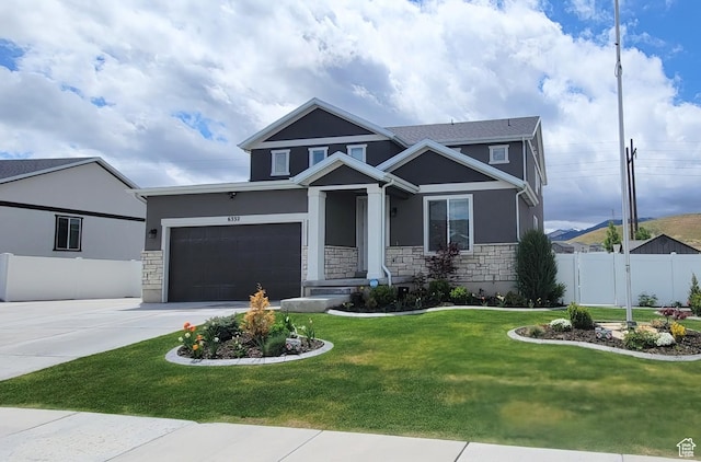craftsman-style home featuring stone siding, stucco siding, a garage, and concrete driveway