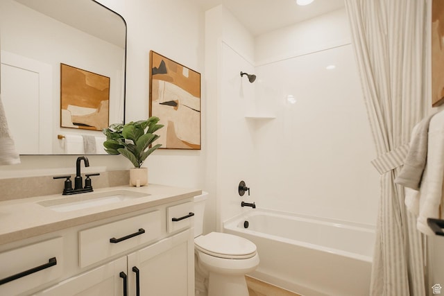 full bathroom with toilet, shower / tub combo with curtain, and vanity