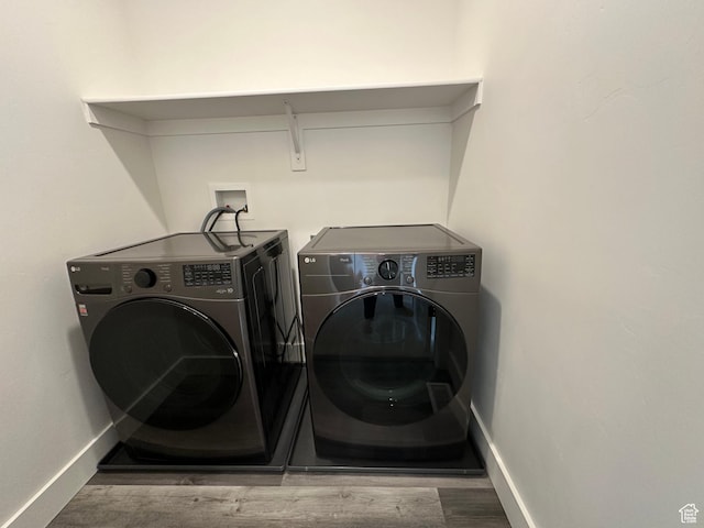 568 S 900 W, American Fork, UT 84003 - washroom featuring washer and clothes dryer, wood finished floors, and baseboards