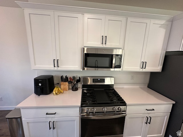568 S 900 W, American Fork, UT 84003 - kitchen featuring appliances with stainless steel finishes, white cabinetry, and light countertops