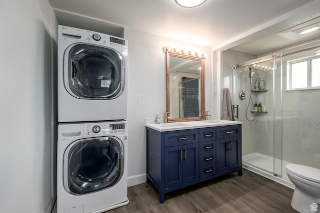 547 N 650 E, Orem, UT 84097 - laundry area featuring stacked washer and clothes dryer and dark wood-type flooring