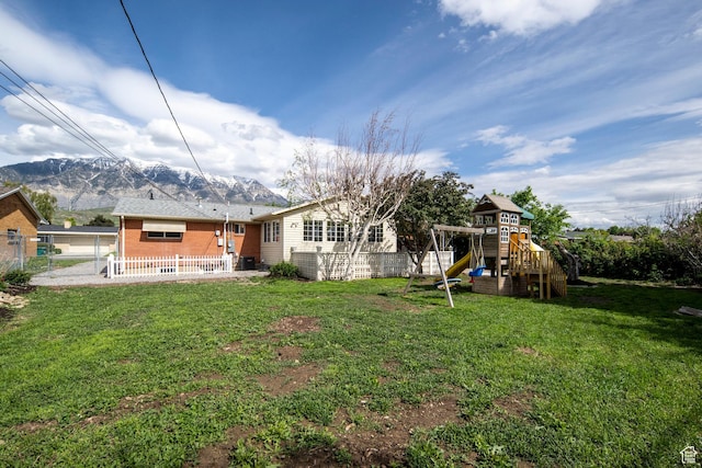 547 N 650 E, Orem, UT 84097 - back of property featuring a playground, a mountain view, and brick siding