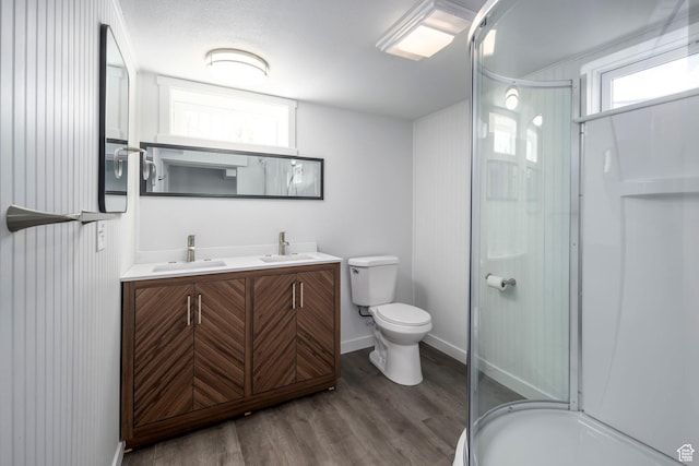 547 N 650 E, Orem, UT 84097 - bathroom featuring a shower stall, wood finished floors, toilet, and healthy amount of natural light