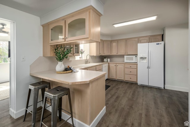 547 N 650 E, Orem, UT 84097 - kitchen featuring white appliances, light brown cabinets, and a peninsula