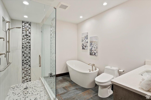 3749 N Eagle Ridge Dr E, Eden, UT 84310 - full bathroom with a freestanding tub, a stall shower, recessed lighting, toilet, and vanity