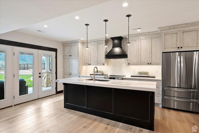 3749 N Eagle Ridge Dr E, Eden, UT 84310 - kitchen with freestanding refrigerator, custom exhaust hood, a sink, french doors, and light countertops