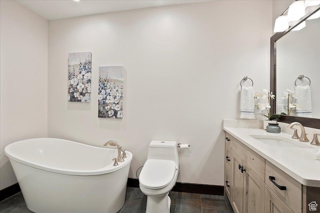 3749 N Eagle Ridge Dr E, Eden, UT 84310 - full bathroom with baseboards, vanity, a soaking tub, and toilet