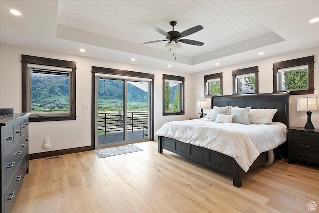 3749 N Eagle Ridge Dr E, Eden, UT 84310 - bedroom featuring a raised ceiling, wood ceiling, access to outside, baseboards, and light wood-style flooring